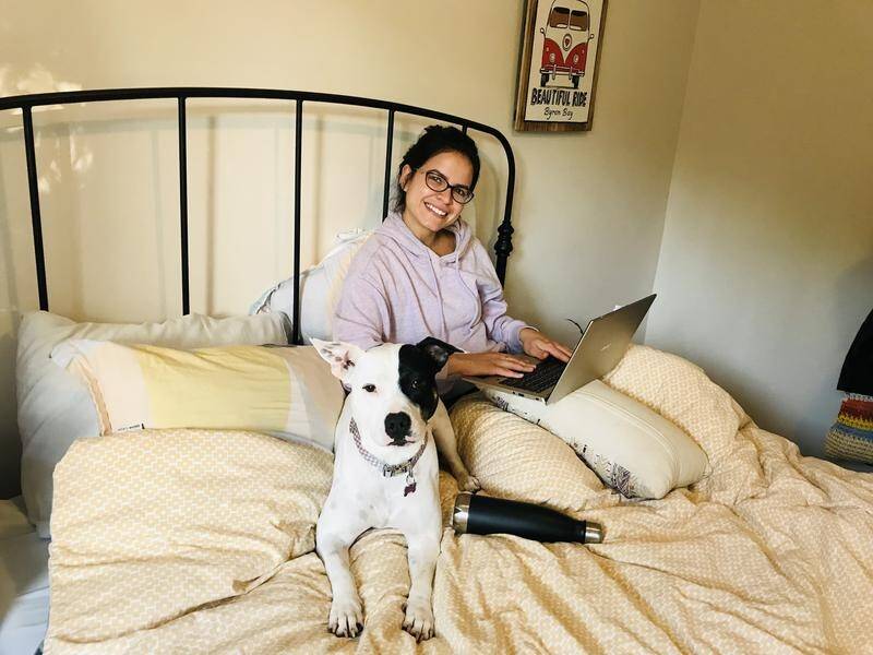 Working from home has led to working from bed for some Australians, including Eloa Marins.