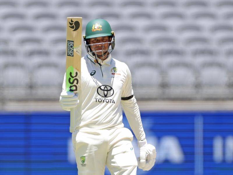 Usman Khawaja sports a black armband while batting during the first Test against Pakistan in Perth. (Richard Wainwright/AAP PHOTOS)