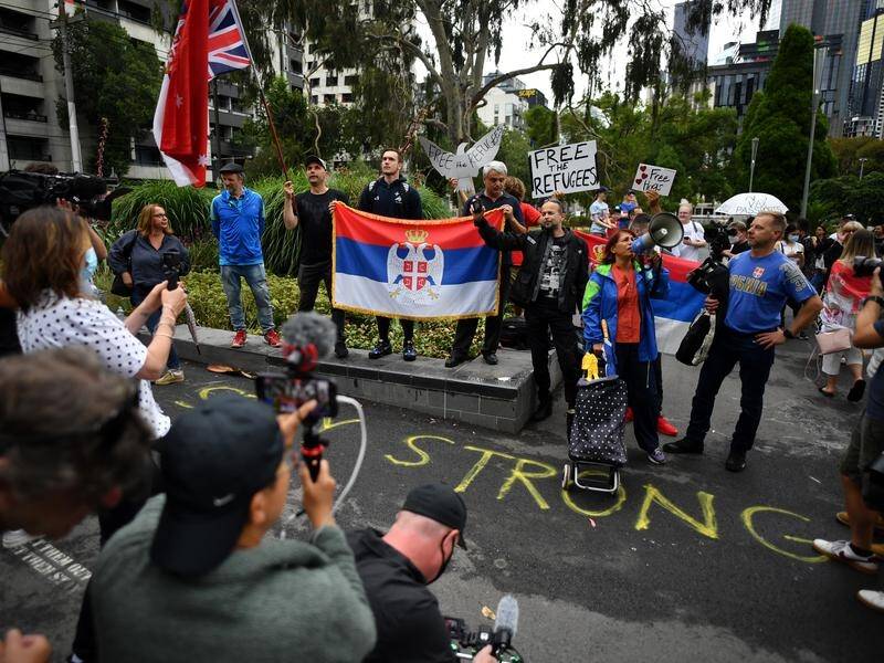 Djokovic fans protested outside his immigration detention hotel as refugee advocates condemned him.