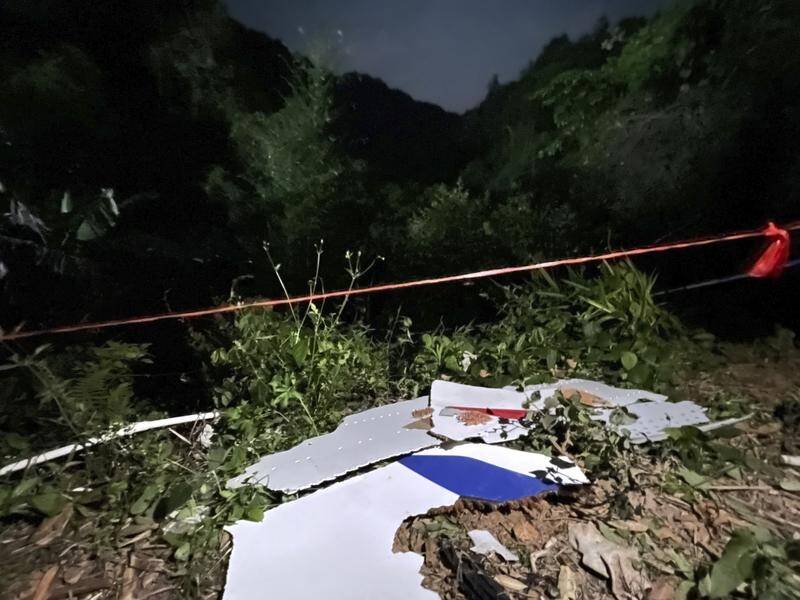 Wreckage of the China Eastern Airlines jet with 132 people aboard that crashed into a mountain.