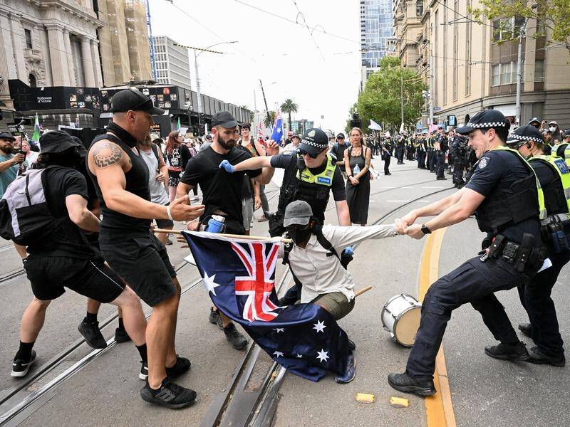 Police prevented a brawl between opposing groups at an anti-trans rally in Melbourne's CBD. (James Ross/AAP PHOTOS)