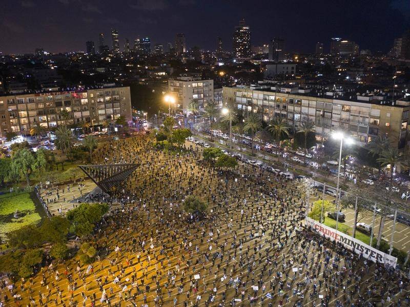People demonstrate in Tel Aviv against a deal last week that leaves PM Benjamin Netanyahu in power.