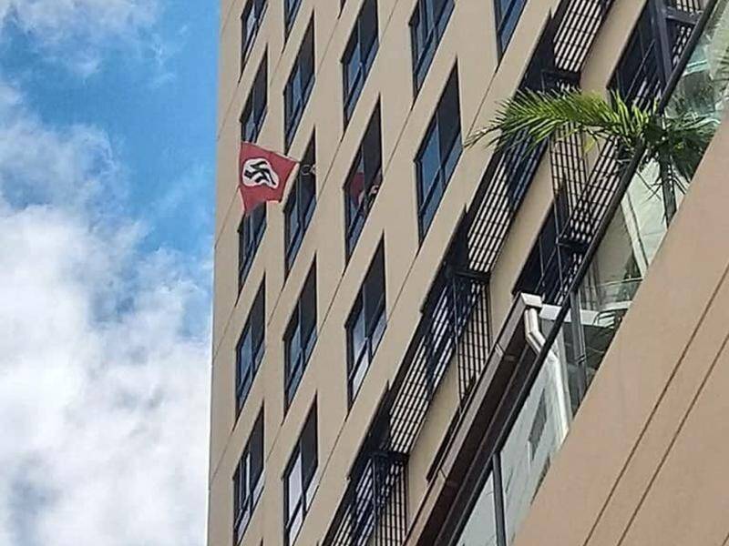 Police have seized a Nazi flag that was flown from an apartment window near a Brisbane synagogue.