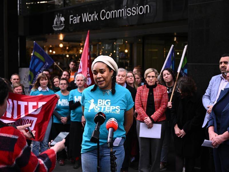 Djarra Liotta-Ndiaye, an educator from SA, speaks outside the Fair Work Commission in Melbourne. (Joel Carrett/AAP PHOTOS)