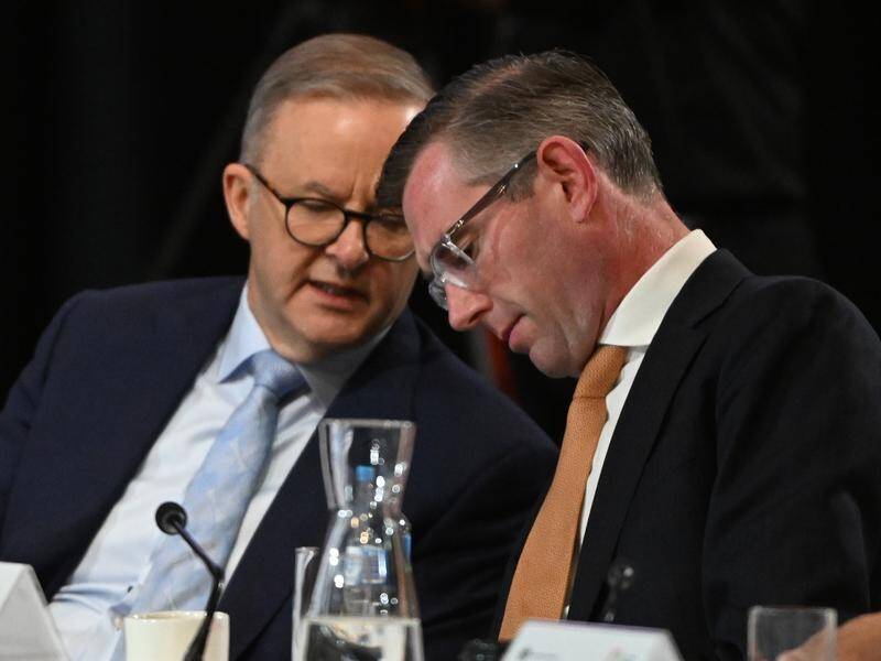 While the details differ, both Anthony Albanese and Dominic Perrottet want to ease the COVID rules. (Mick Tsikas/AAP PHOTOS)