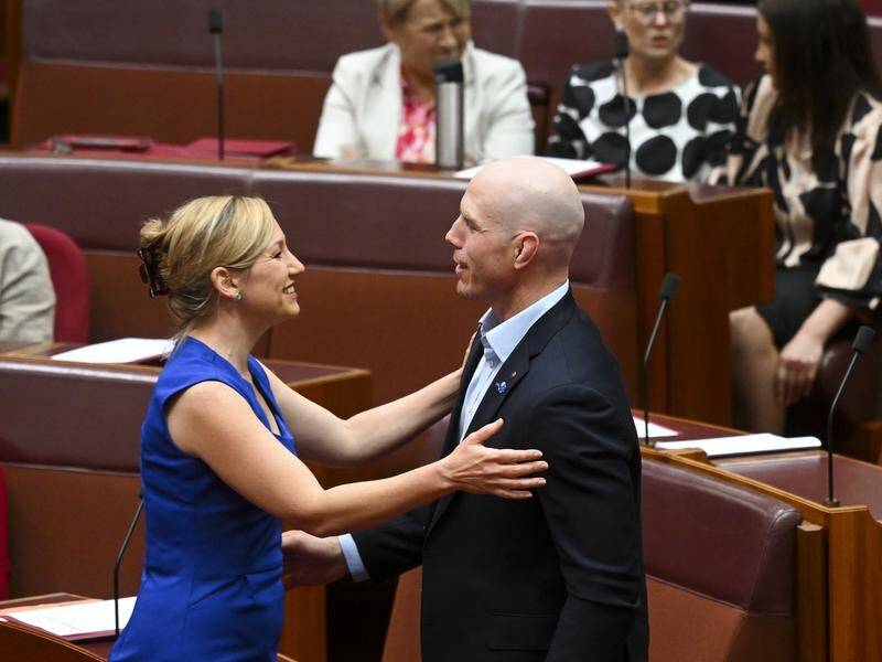 Greens senator Larissa Waters congratulated senator David Pocock after the territories' rights vote. (Lukas Coch/AAP PHOTOS)