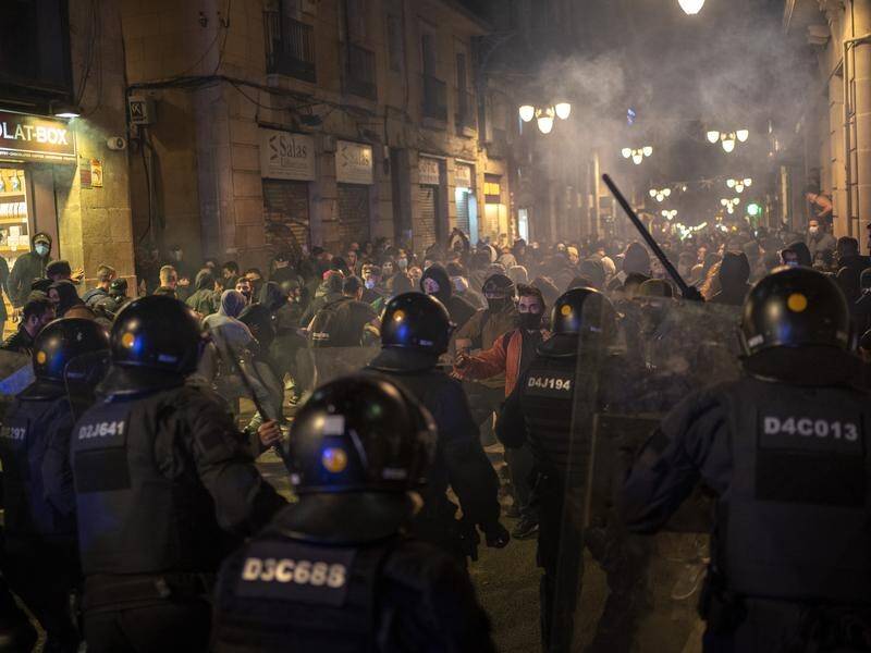 Police say about 50 demonstrators threw bricks and fireworks during clashes in Barcelona.
