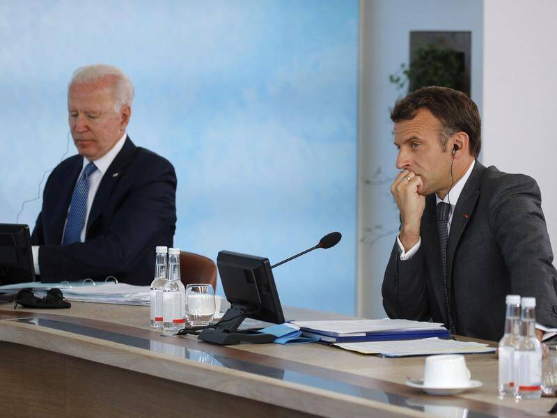 G7 leaders including Joe Biden (L) and Emmanuel Macron agreed to take a unified stance on China.