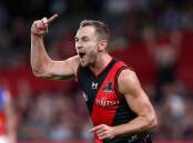 Devon Smith's return is the only change in Essendon's team to face Richmond in the Dreamtime clash.