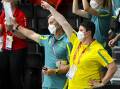 Australia's Chef de Mission Petria Thomas (r), wears a mask while watching swimming events. (Dave Hunt/AAP PHOTOS)