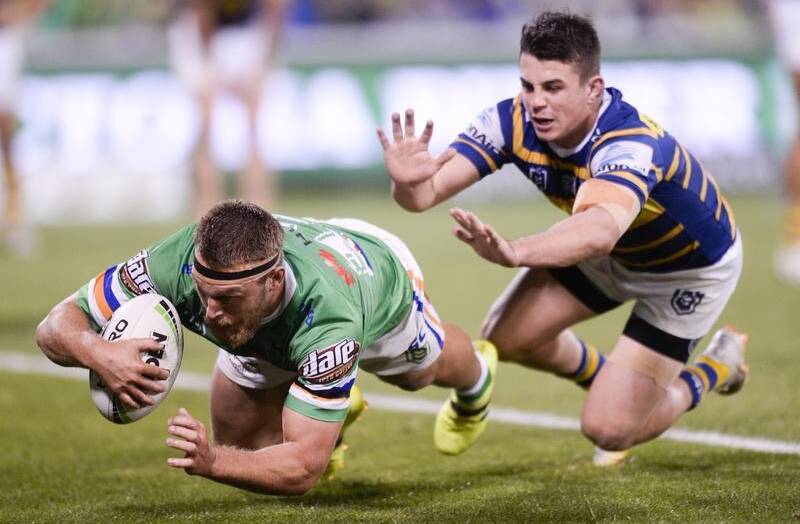 Elliott Whitehead scores for the Raiders in their comfortable NRL win over the Eels. Photo: AAP  