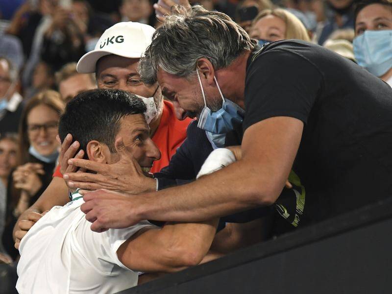 Novak Djokovic, one of tennis's "three knights", being saluted by his coach Goran Ivanisevic.