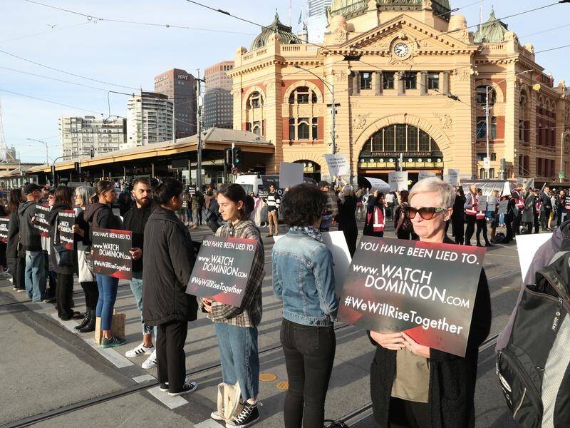 Animal rights' protesters blocked the intersections of Flinders and Swanston Streets in Melbourne.