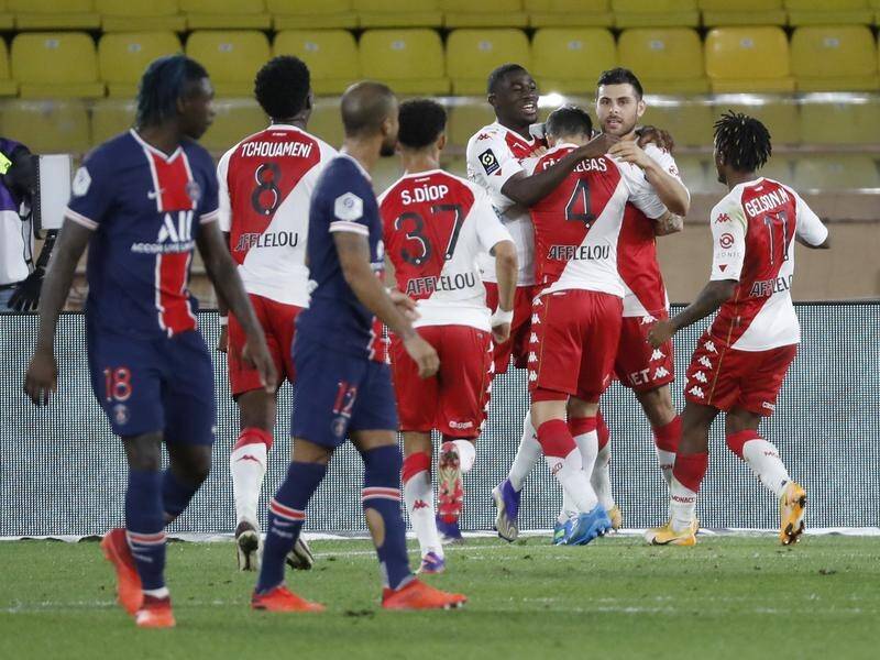 Cesc Fabregas celebrates his winning goal in their Ligue 1 defeat of Paris Saint-Germain.