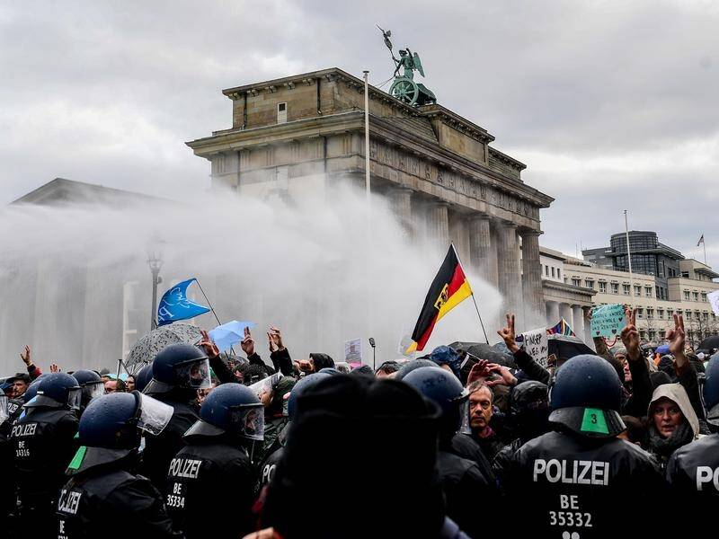 Police have employed water cannon against anti-lockdown protesters in Berlin.