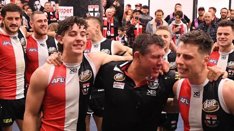 St Kilda senior coach Brett Ratten, centre, won the top job after successful trial period, an approach that could be better used in the public service.