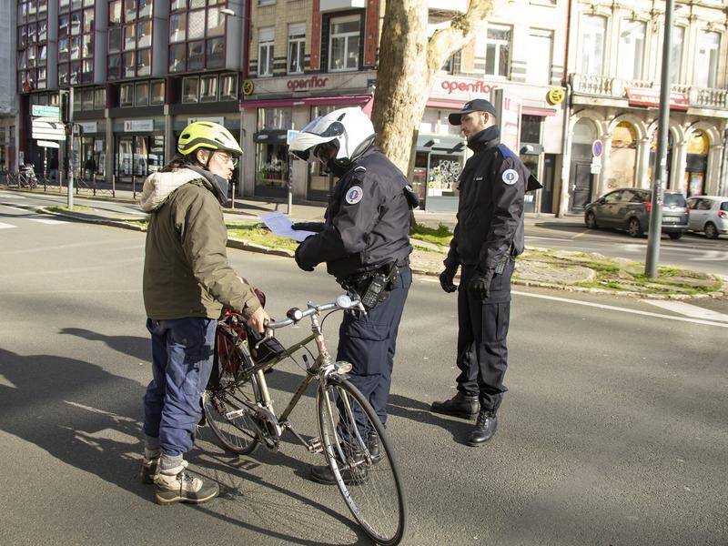 Police in France are stopping drivers and pedestrians to demand documents justifying their movement.
