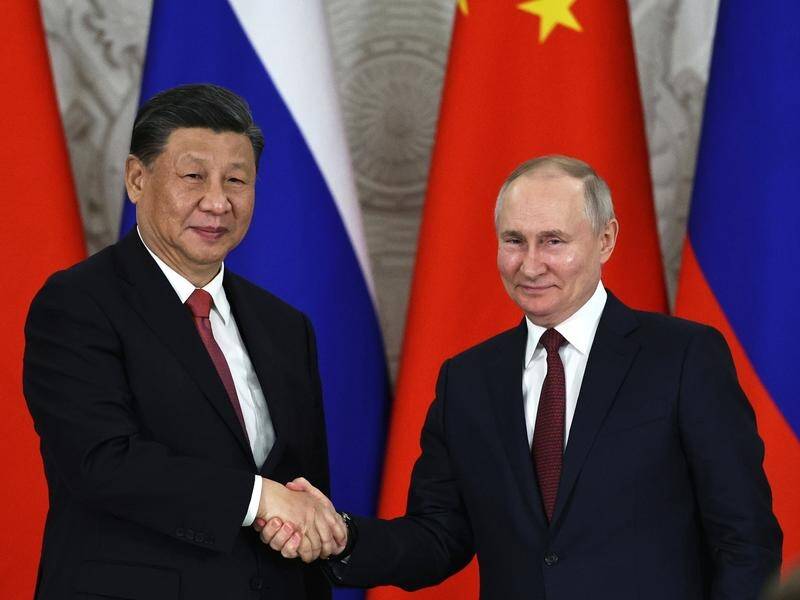 Chinese President Xi Jinping and Russian President Vladimir Putin will meet in Beijing on Wednesday. (AP PHOTO)