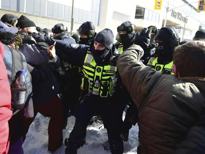 Hundreds of police moved in on protesters despite the frigid temperature and freshly fallen snow.