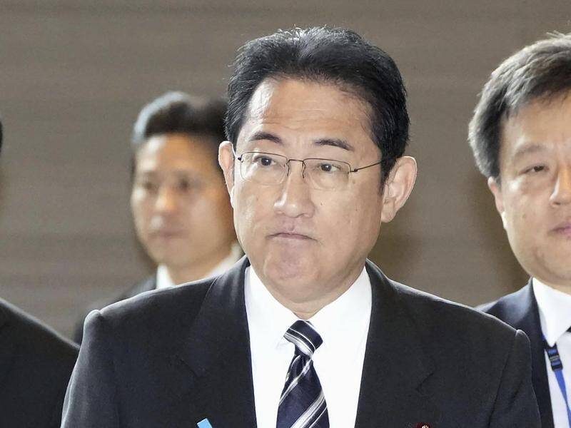 Japan's Prime Minister Fumio Kishida has fired his son as secretary over a private party. (AP PHOTO)