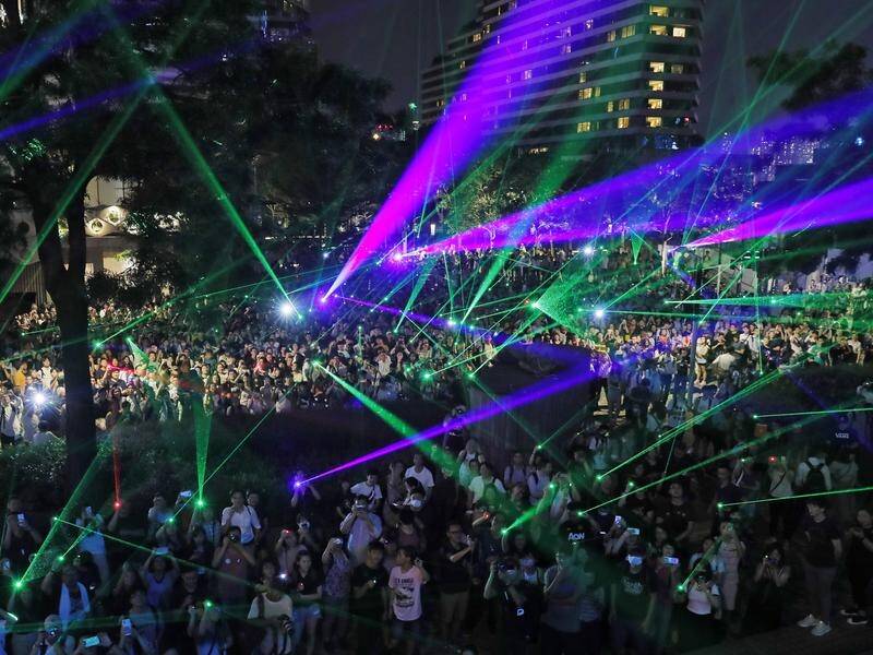 Hong Kong protesters use laser pointers after police arrested people for having the devices.