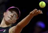 Iga Swiatek serves against Elise Mertens in her opening match at the clay-court Stuttgart Open. (AP PHOTO)