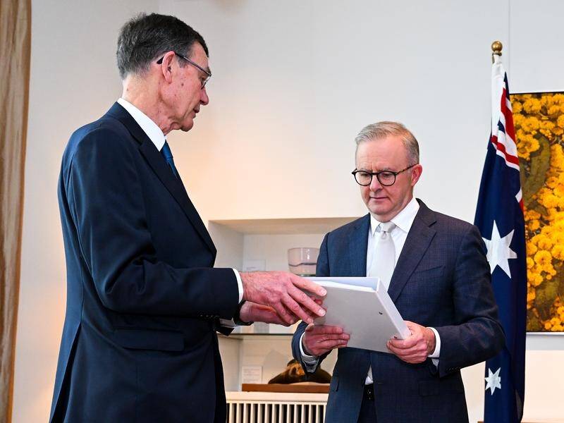 Anthony Albanese (right) received the Defence Strategic Review report from Angus Houston last week. (Lukas Coch/AAP PHOTOS)