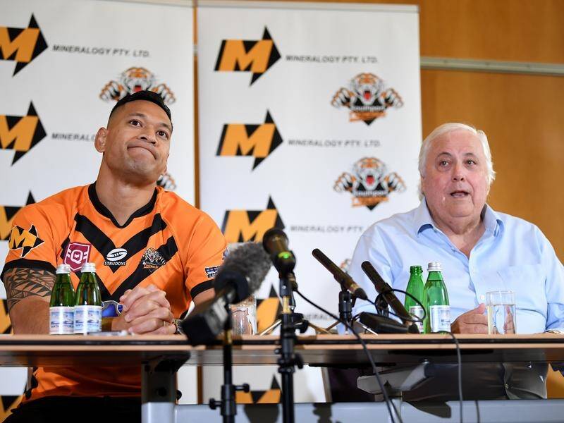 Clive Palmer (r) wants Israel Folau registered to play for Southport Tigers this weekend.