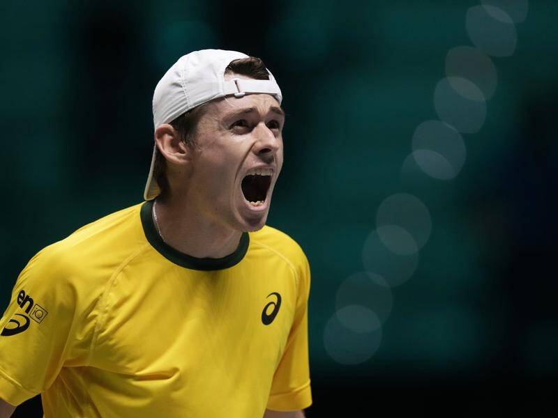 Alex de Minaur roars with relief after his superb Davis Cup singles win over Marton Fucsovics.