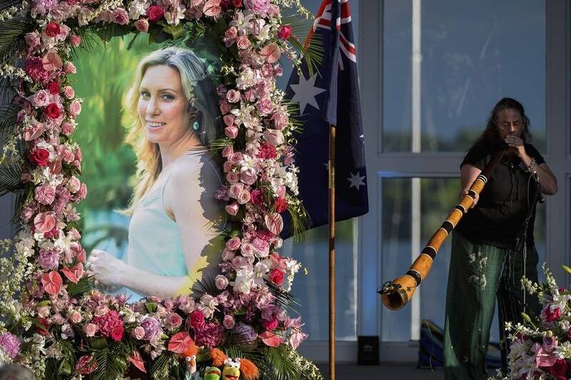 Johanna Morrow plays the didgeridoo during a memorial service for Justine Ruszczyk Damond at Lake Harriet in Minneapolis in 2017. Picture: AP

