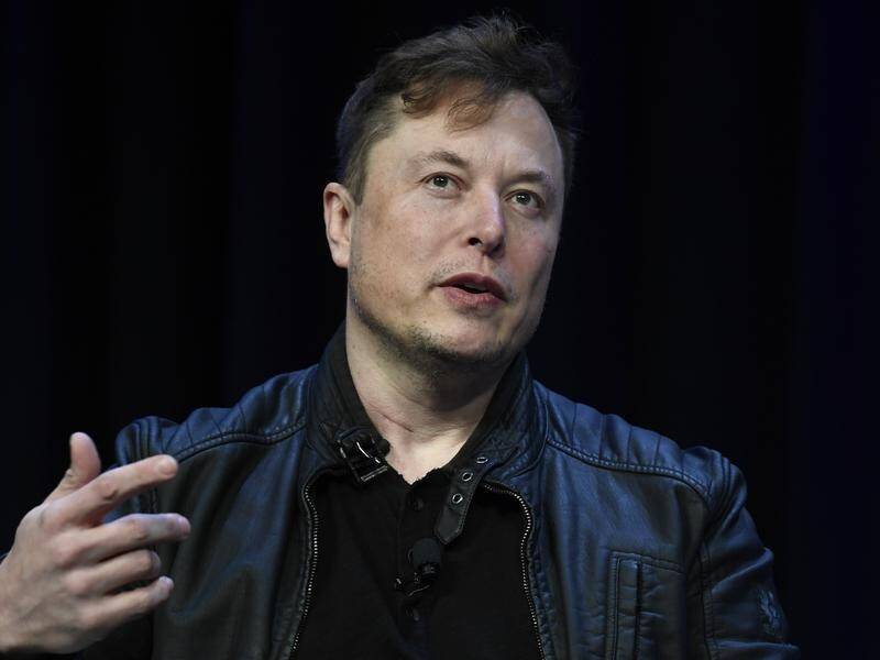 Elon Musk says he'll abide by the results of his Twitter poll asking if he should step down as head. (AP PHOTO)