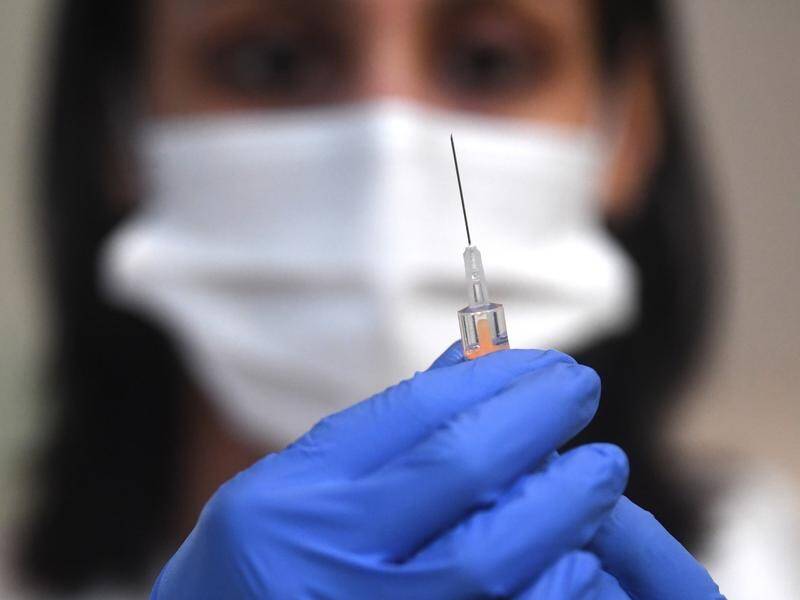 The PM says a successful vaccine rollout could see Australia reopening international borders.