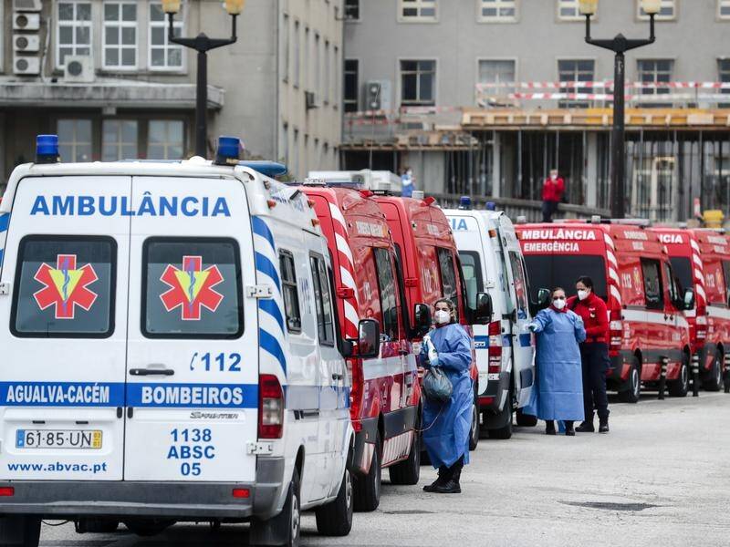 Ambulances queue at a in Lisbon amid Portugal's coronavirus crisis.