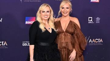 Rebel Wilson (left) says coming out to her family was easier for her than for fiancee Ramona Agruma. (Darren England/AAP PHOTOS)