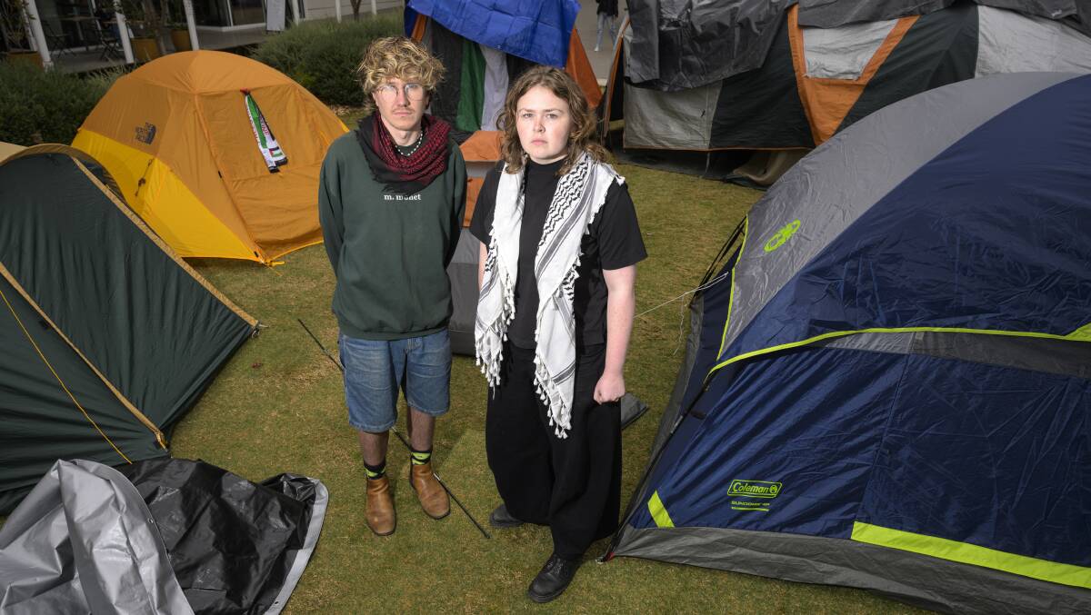 Students Beatrice Tucker and Luke Manning at the pro-Palestine tent encampment at the ANU. Picture by Keegan Carroll