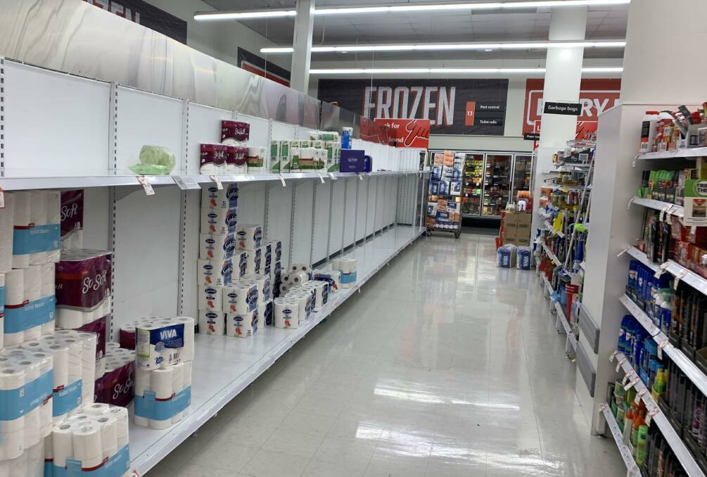 Near empty shelves at Coles Canberra Centre on Friday Night. Picture: Julia Kanapathippillai
