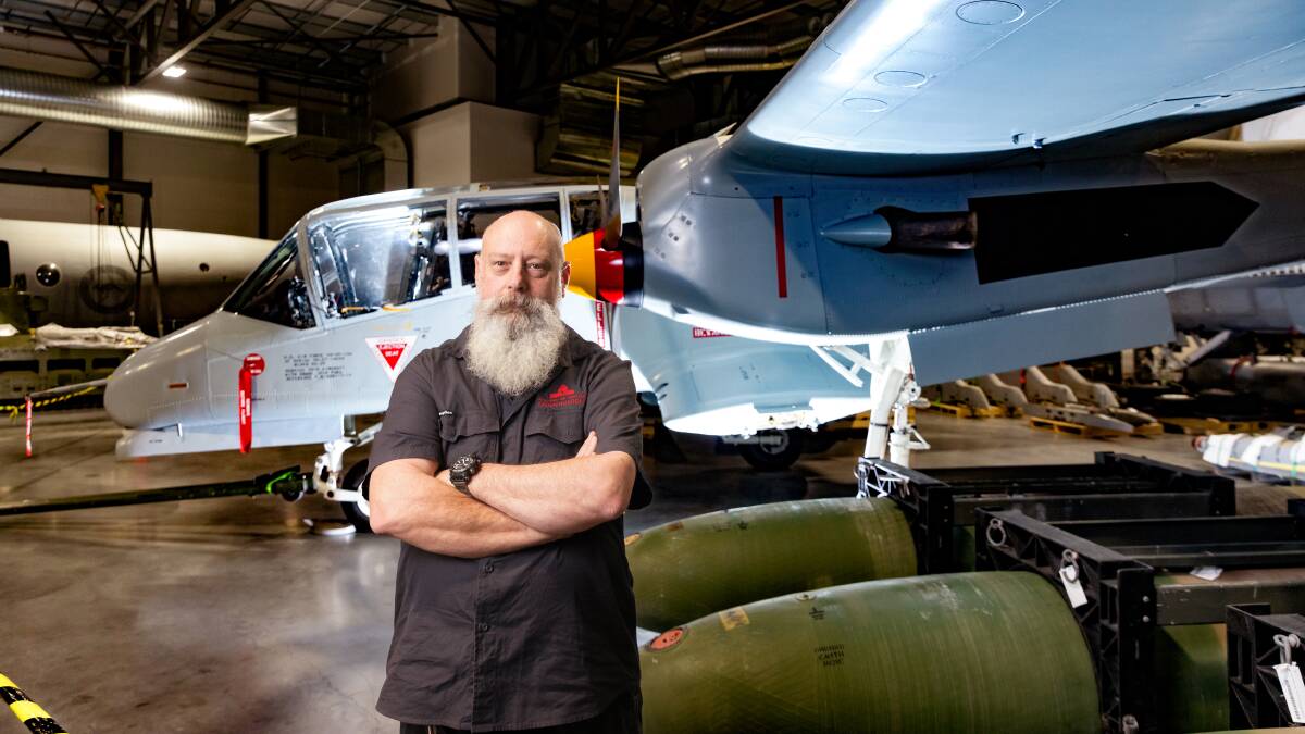 Kim "Woody" Wood and the OV-10A Bronco which he restored. Picture by Sitthixay Ditthavong