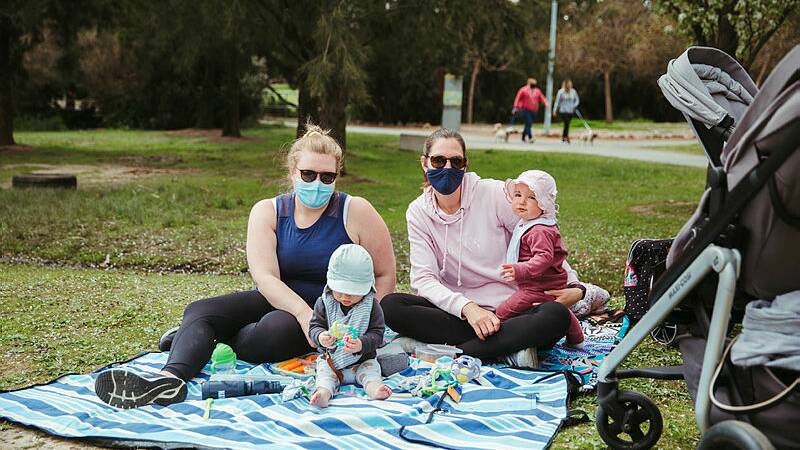 Michaela Eaton; Alfie Eaton, eight months; Ellen Deasy; and Grace Deasy, nine months; at Yerrabi Pond. Picture: Dion Georgopoulos