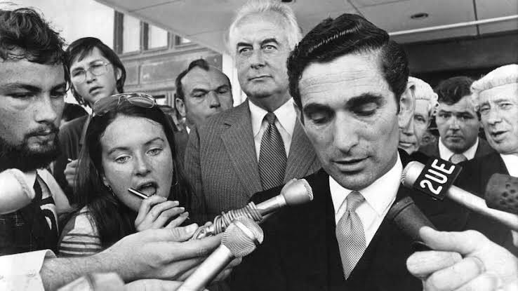 David Smith reading the proclamation to dissolve parliament in 1975. Gough Whitlam is behind his right shoulder. Picture: Supplied