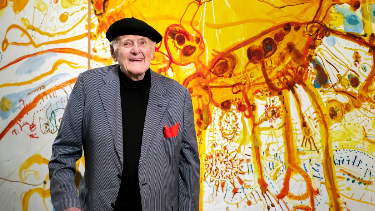 John Olsen in front of his painting Sydney Sun at the National Gallery of Australia. Picture NGA