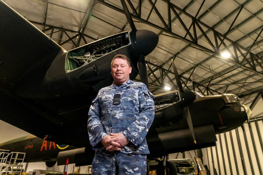 Commanding Officer of 460 Squadron, Wing Commander Anthony Cullen and the Australian War Memorial's Avro Lancaster B1 (G for George). Picture: Sitthixay Ditthavong