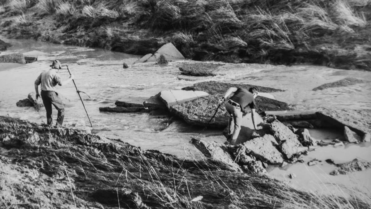 Police searched stormwater drains and Yarralumla Creek for the bodies of people caught in the floods. Picture: Canberra Times archives