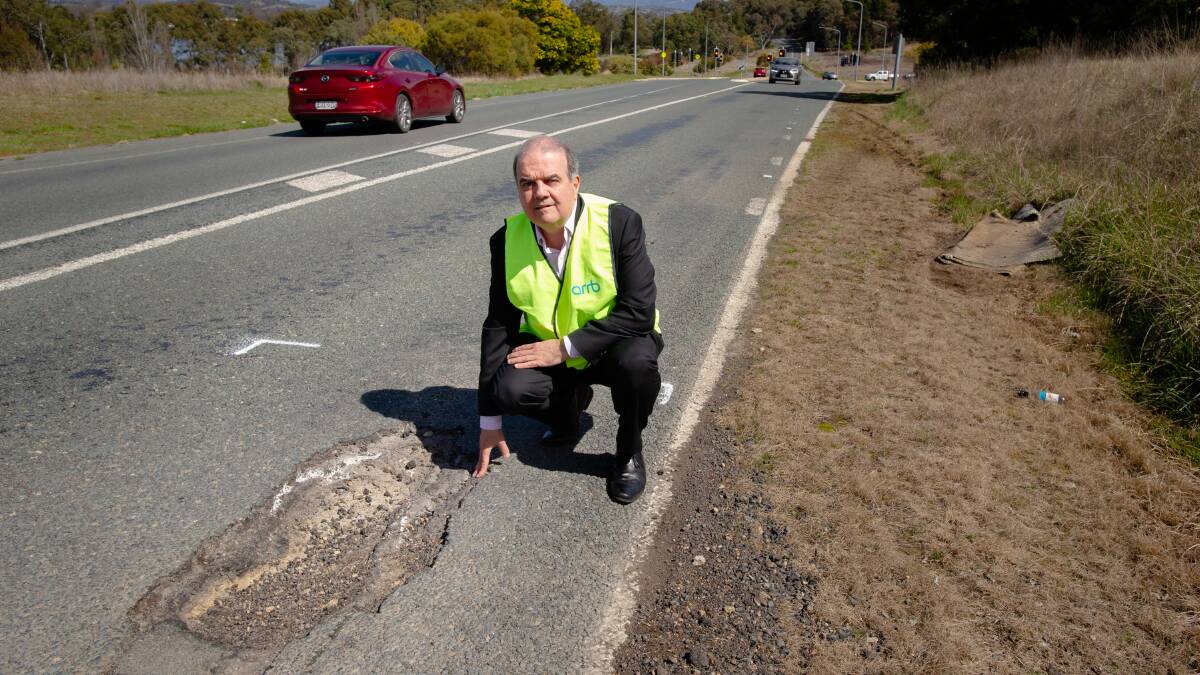 Michael Caltabiano, chief executive of the Australian Road Research Board with his "favourite" pothole. What's yours? Picture by Elesa Kurtz