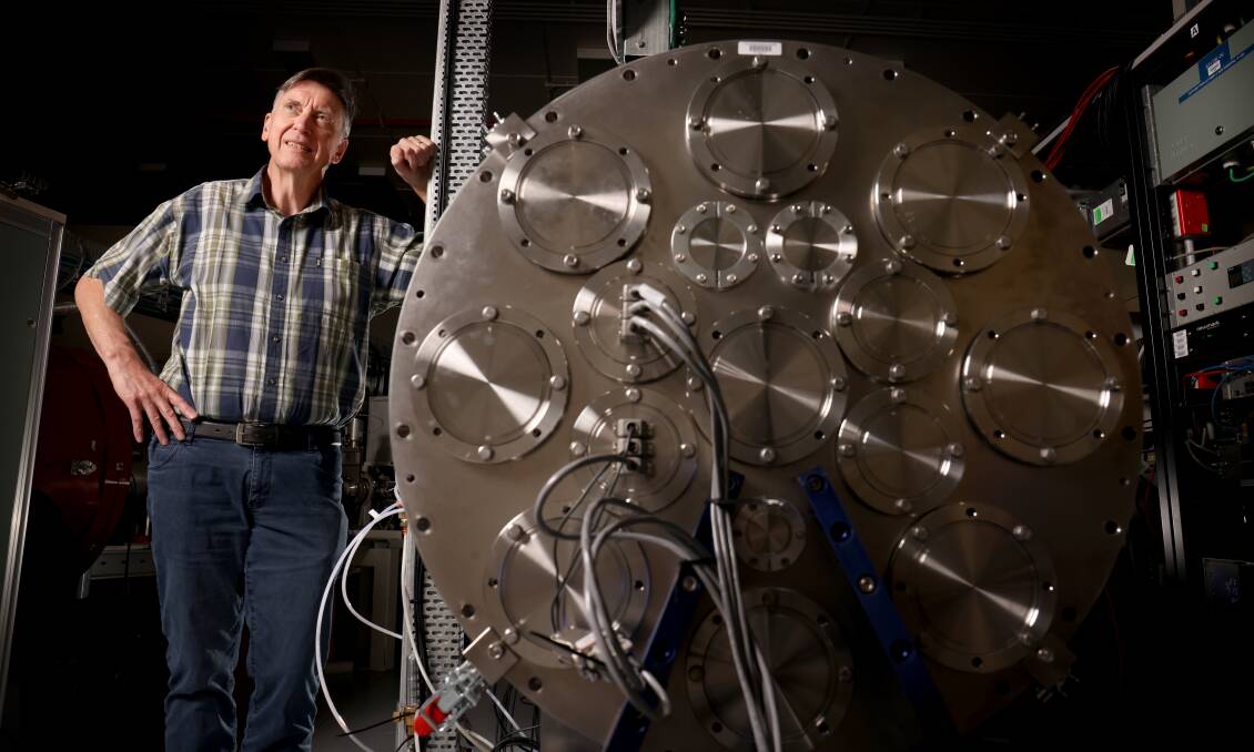 Professor Andrew Stuchbery with the Space Beam Line vacuum chamber at the ANU. There is a shortage of nuclear scientists in Australia. Picture by James Croucher