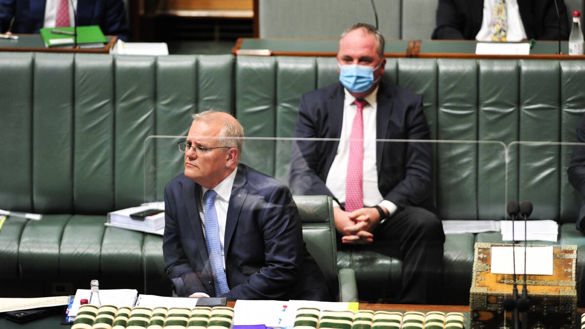 Prime Minister Scott Morrison during House of Representatives Question Time. Deputy Prime Minister Barnaby Joyce sits behind him. Picture: Dion Georgopoulos