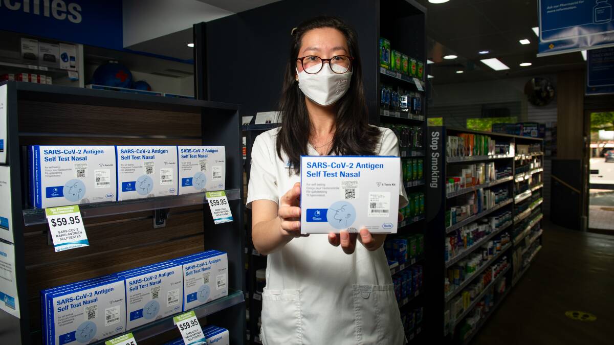 Pharmacist Grace Lee with COVID-19 home testing kit. Picture: Elesa Kurtz