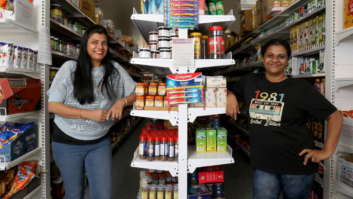 Owner of Ajijo store in Coombs, Jyotsna Kumar, left, and one of her customers, Mathisha Wahikala. Picture by James Croucher