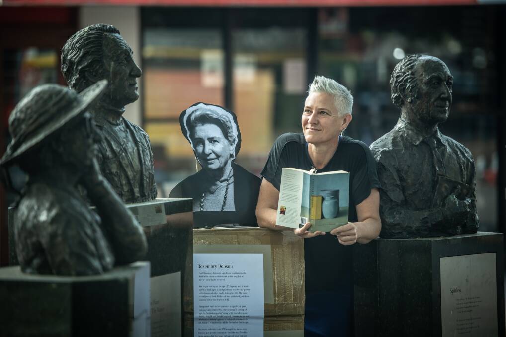 Poet Jacqui Malins brought a picture of the late-Canberran Rosemary Dobson to show where she should fit in. Picture: Karleen Minney