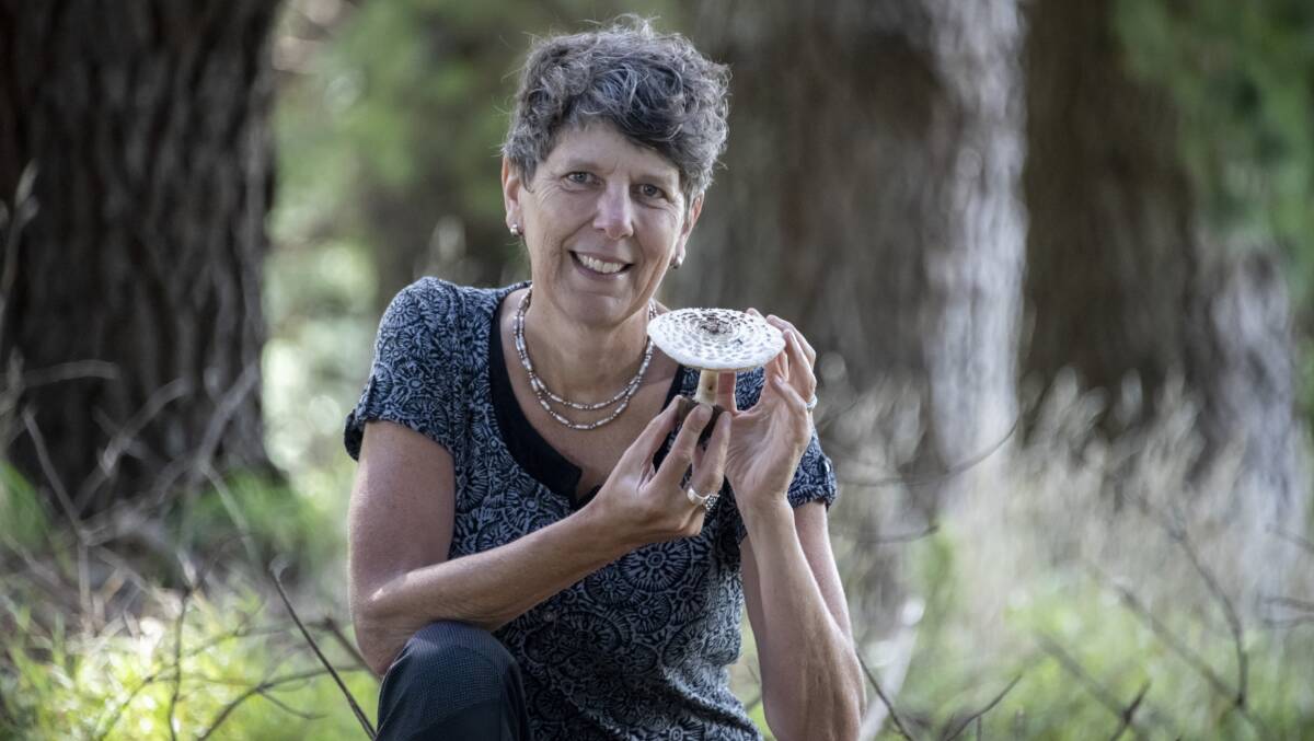 Ecologist and author Dr Alison Pouliot with a poisonous shaggy parasol, commonly found in Canberra. Picture: Valérie Chételat