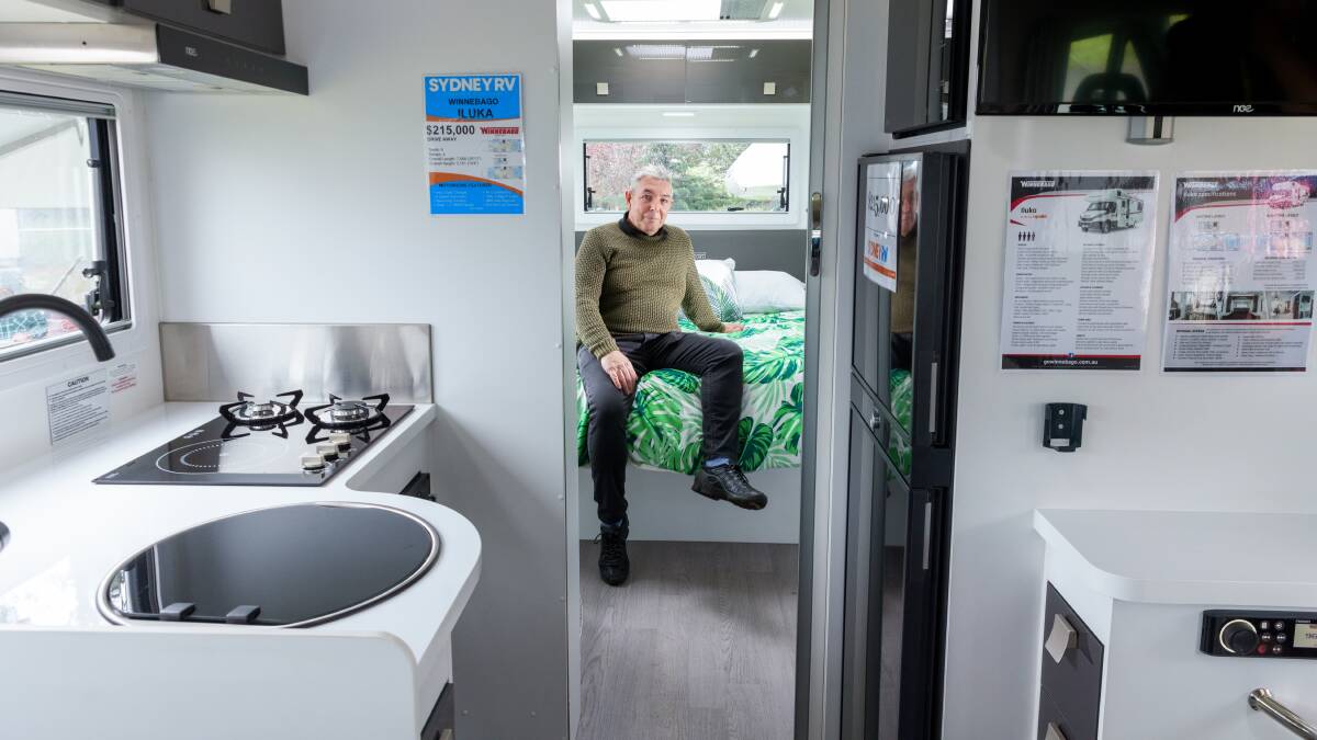 Norman Roe in the grand interior of the Winnebago Iluka at the Canberra Caravan Camping Lifestyle Expo. Picture by Sitthixay Ditthavong